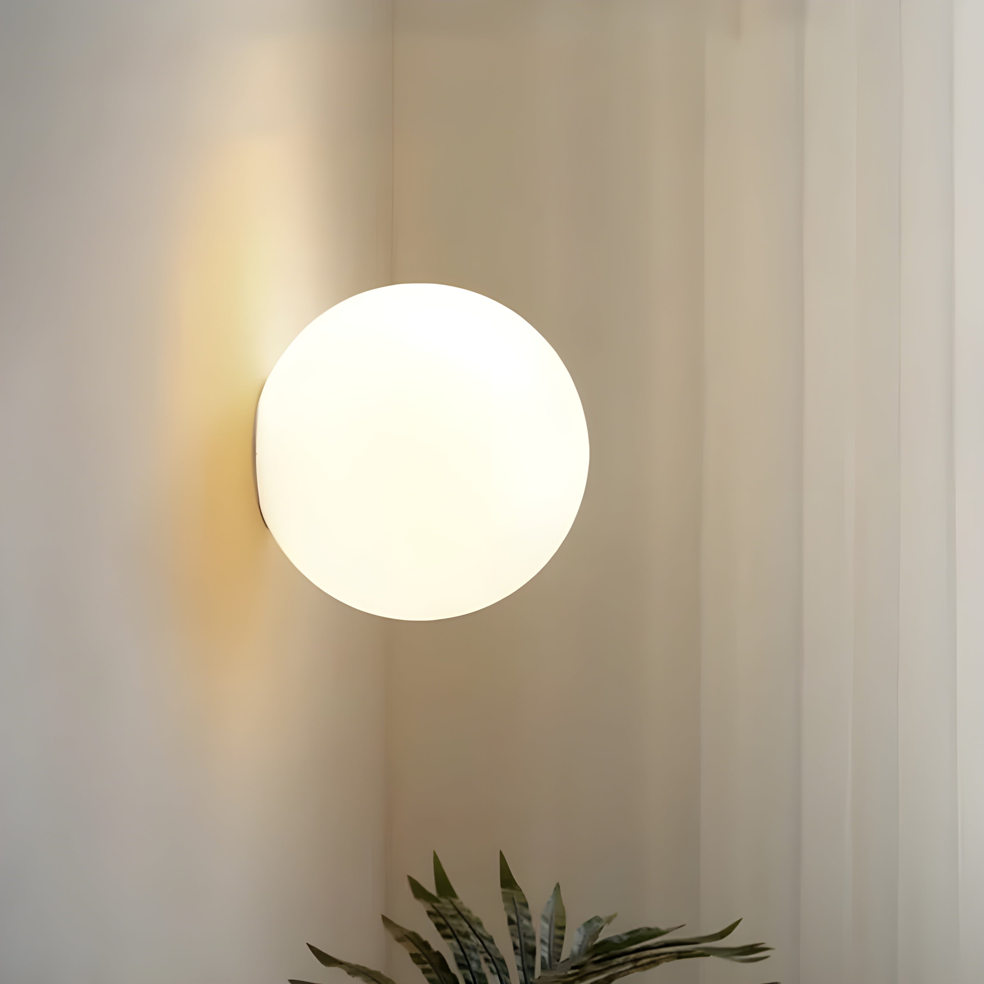 Modern Wall Lamp with Round Frosted Glass Shade and Elegant Base