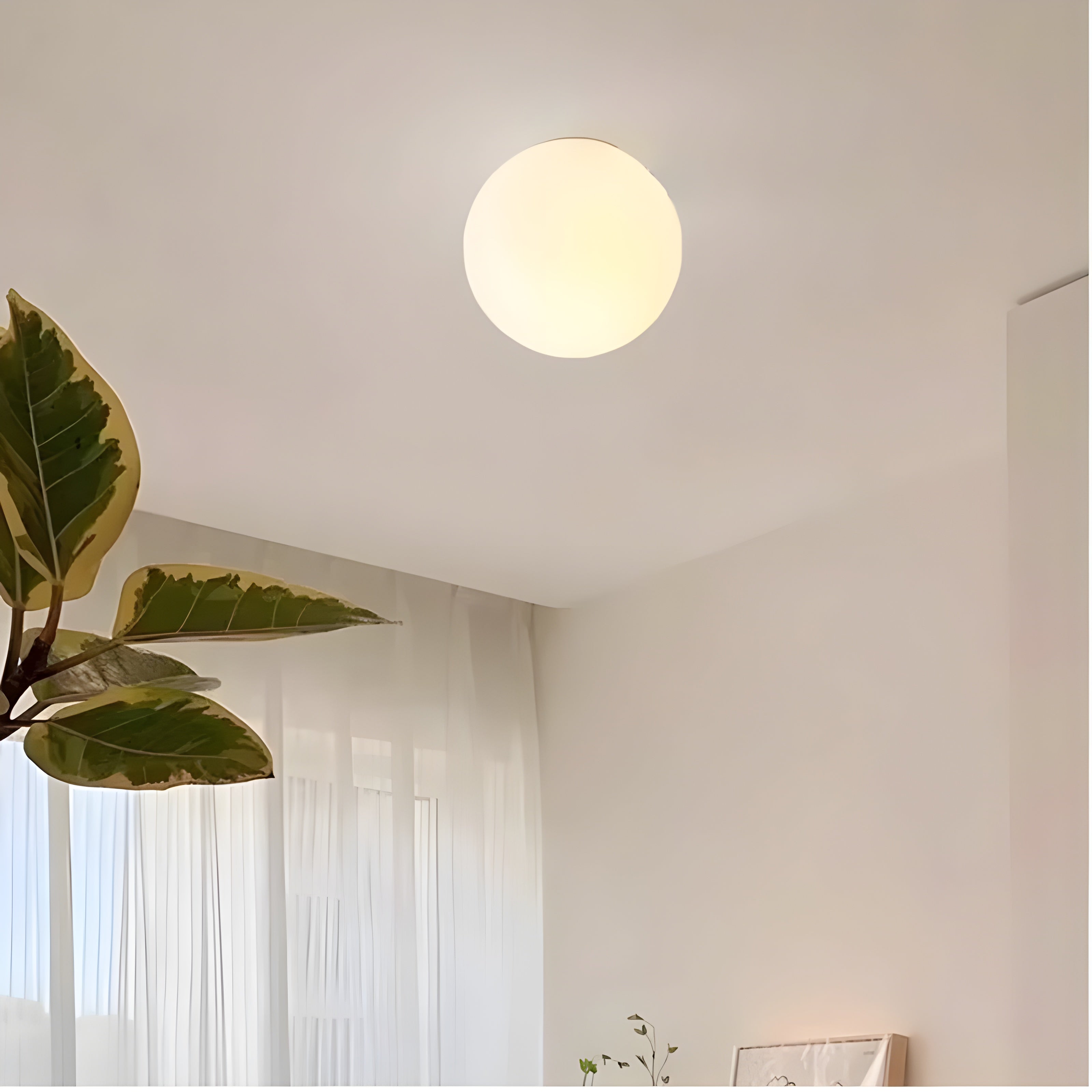 Modern Wall Lamp with Round Frosted Glass Shade and Elegant Base