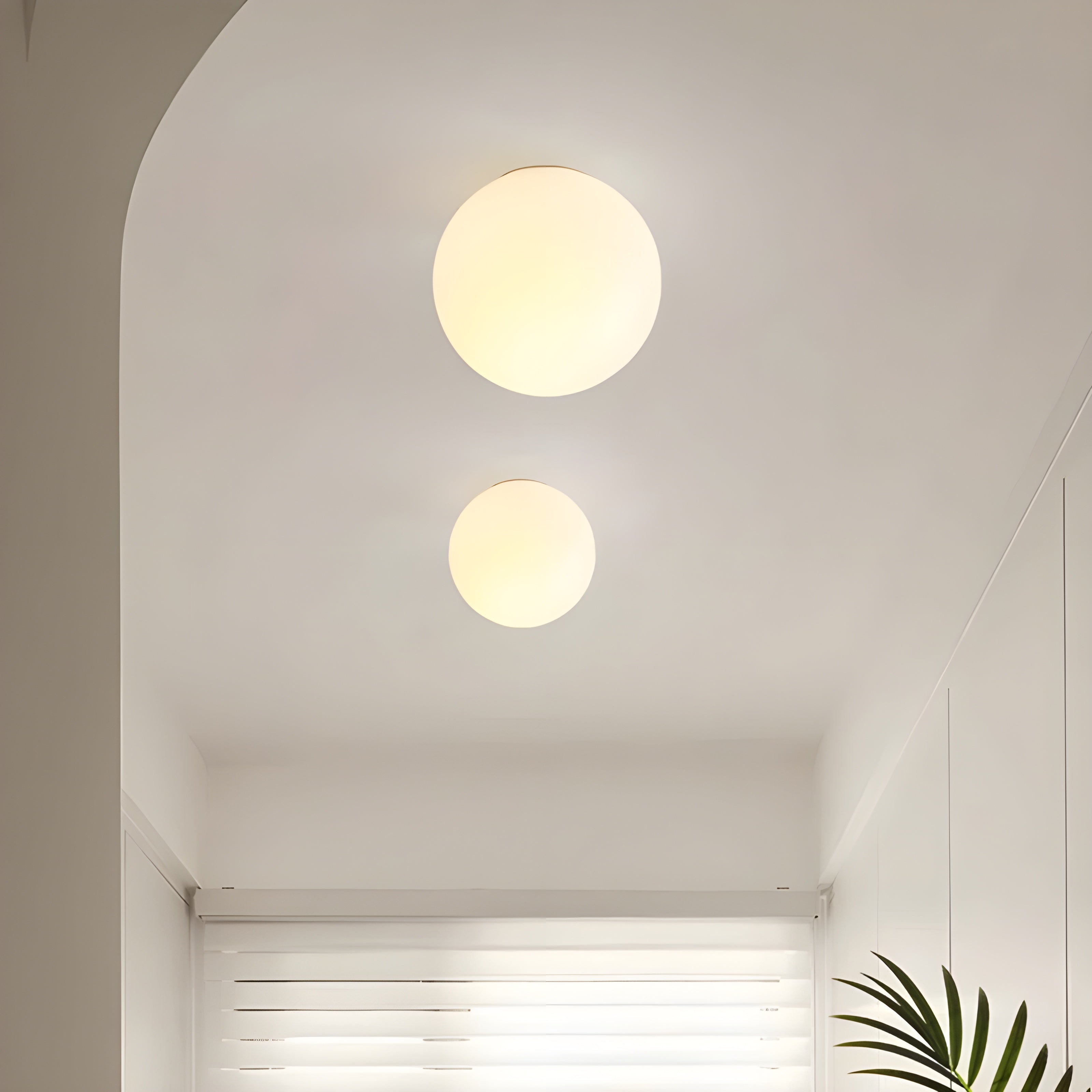 Modern Wall Lamp with Round Frosted Glass Shade and Elegant Base