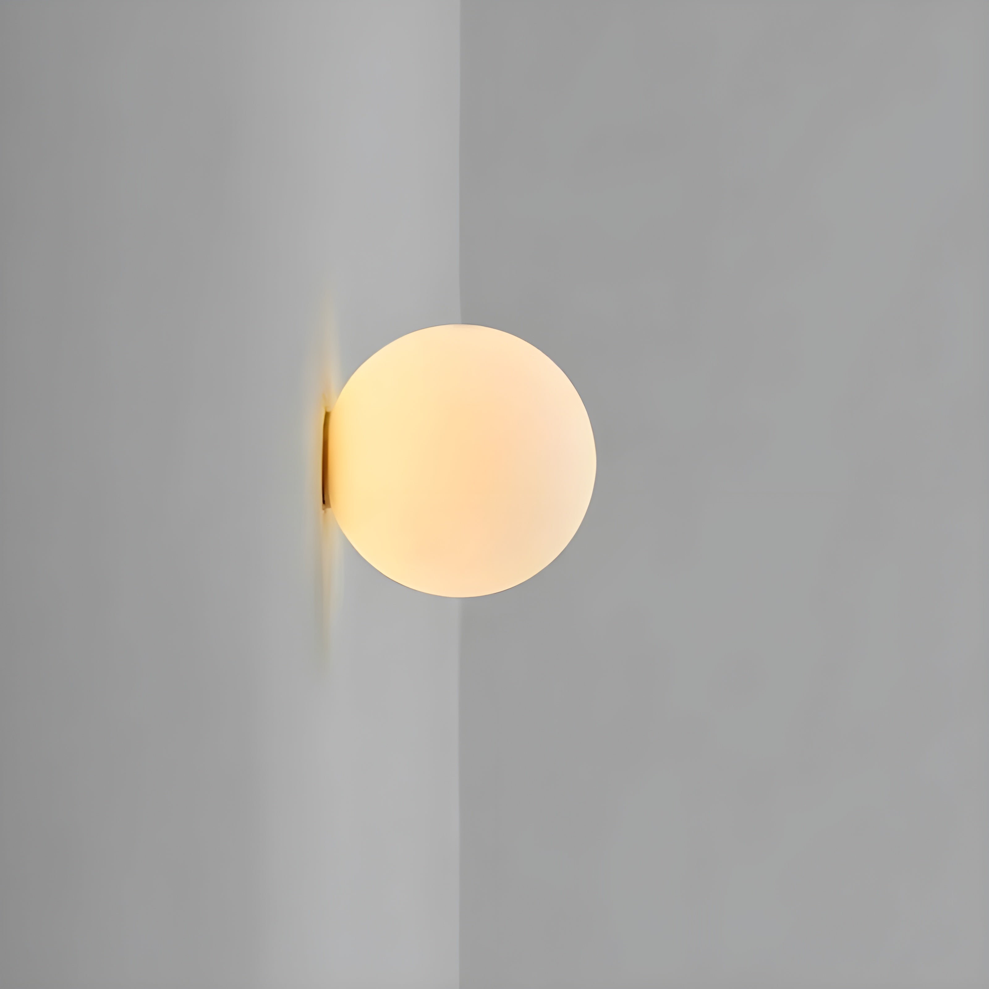 Modern Wall Lamp with Round Frosted Glass Shade and Elegant Base